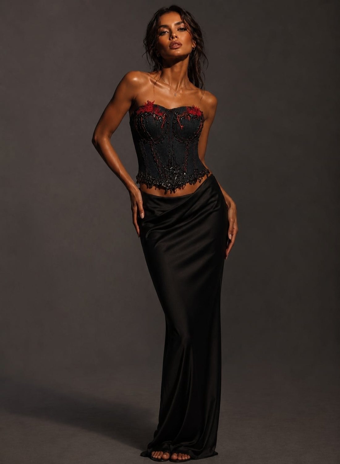 Scarlet Thorn look — denim corset with red embellishment and black satin skirt